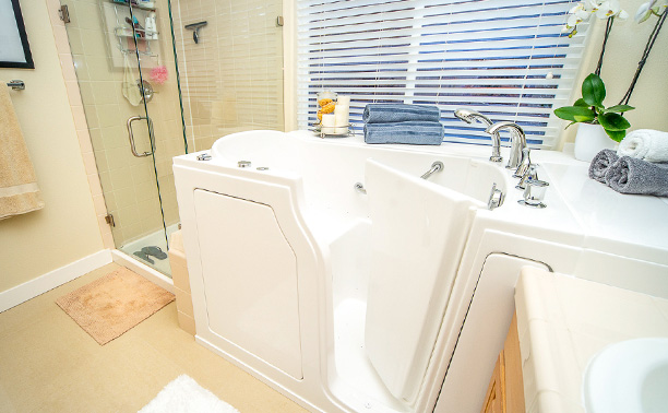 The image shows a bathroom with a white sink, a toilet, and a bathtub, all in pristine condition.